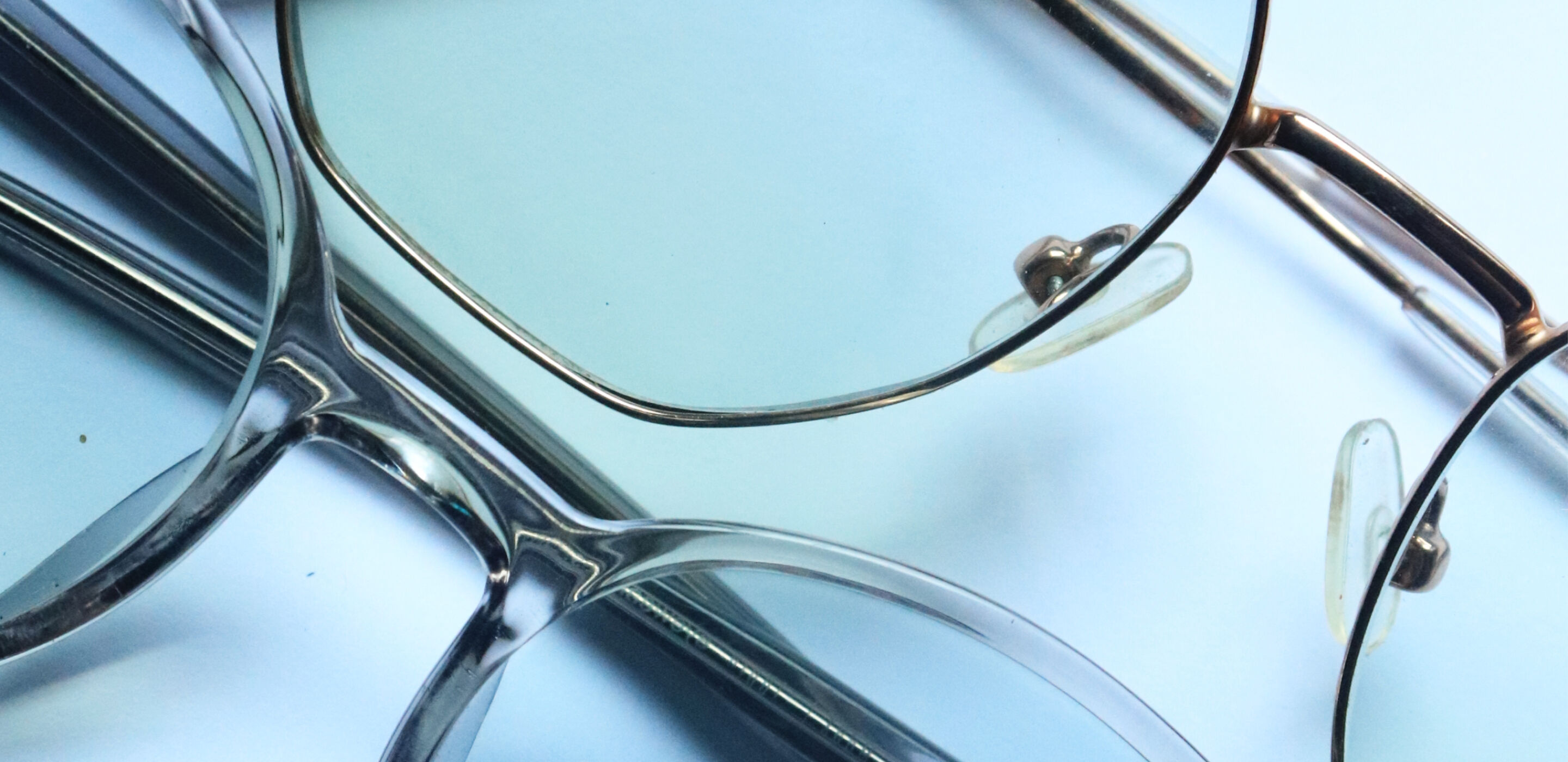 Pair of metal-framed Boots Opticians glasses with clear lenses on a neutral background.