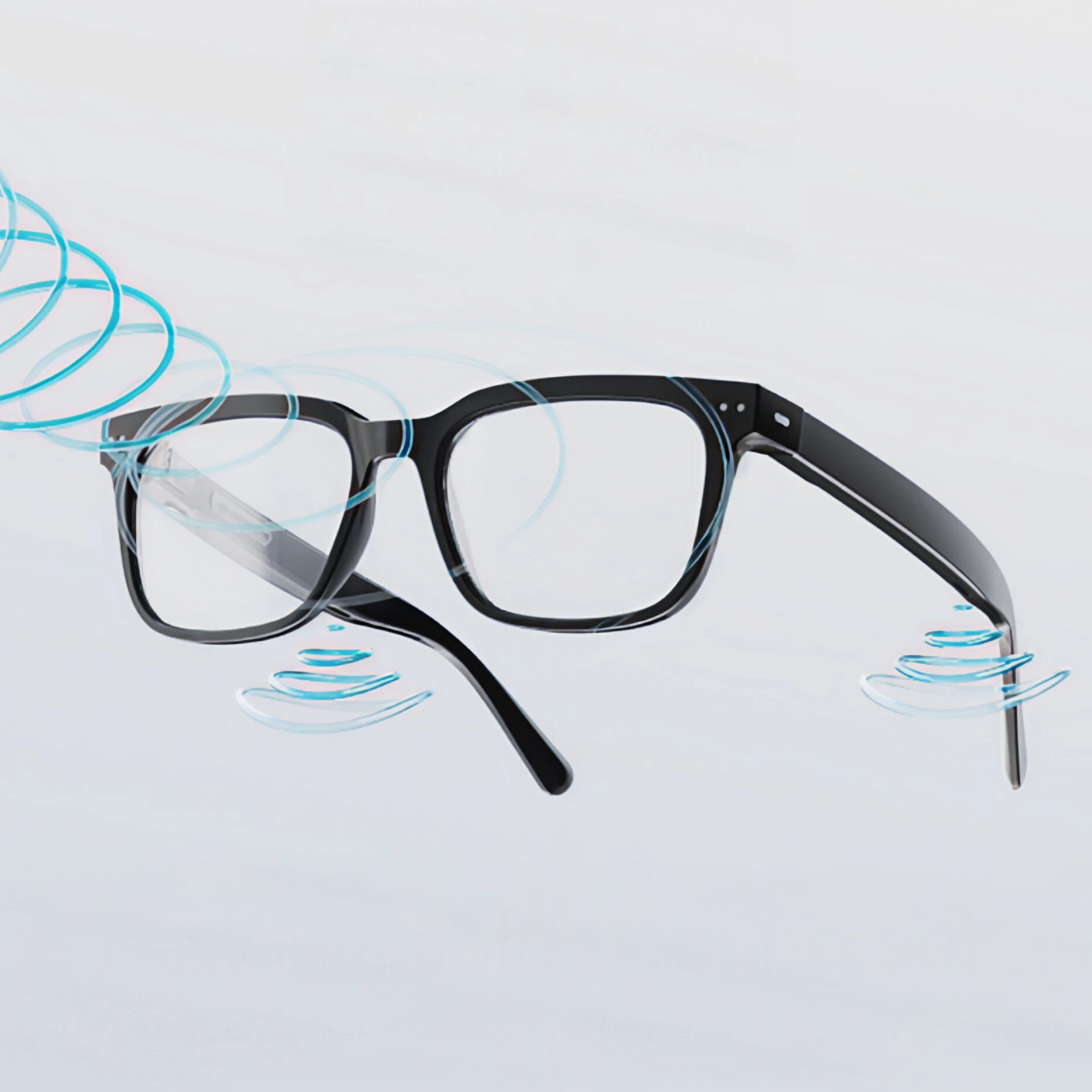 Nuance audio glasses floating with sound waves, highlighting built-in hearing technology.