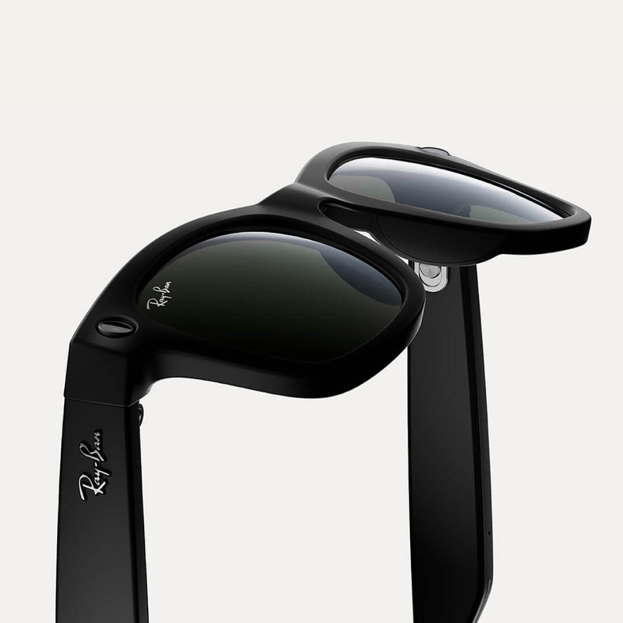 Black Ray-Ban Wayfarer sunglasses with dark lenses and logo on temples, stylish design