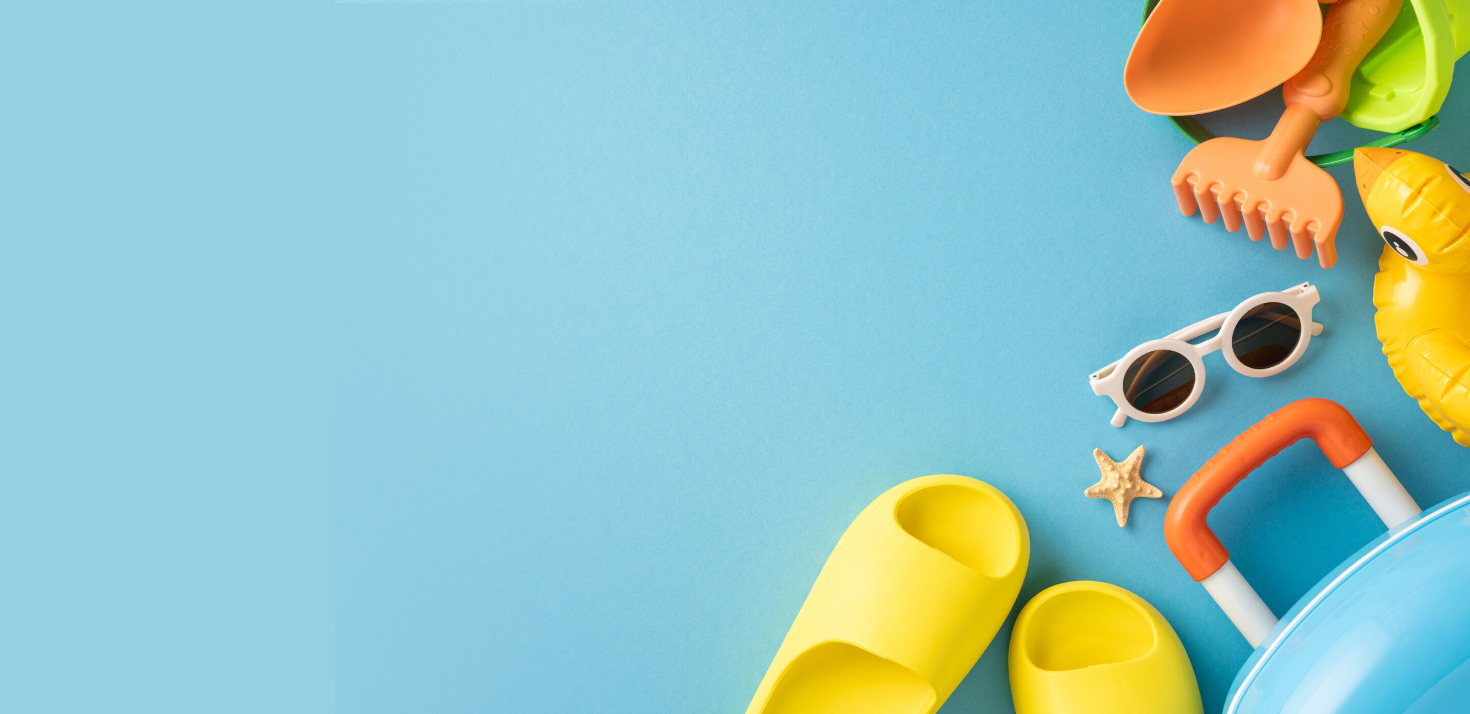 Summer sunglasses and beach items highlighting kids&rsquo; eye protection