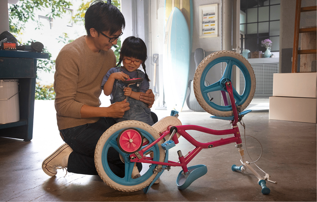 Father and daughter smiling together, highlighting family bonding and eye health awareness.