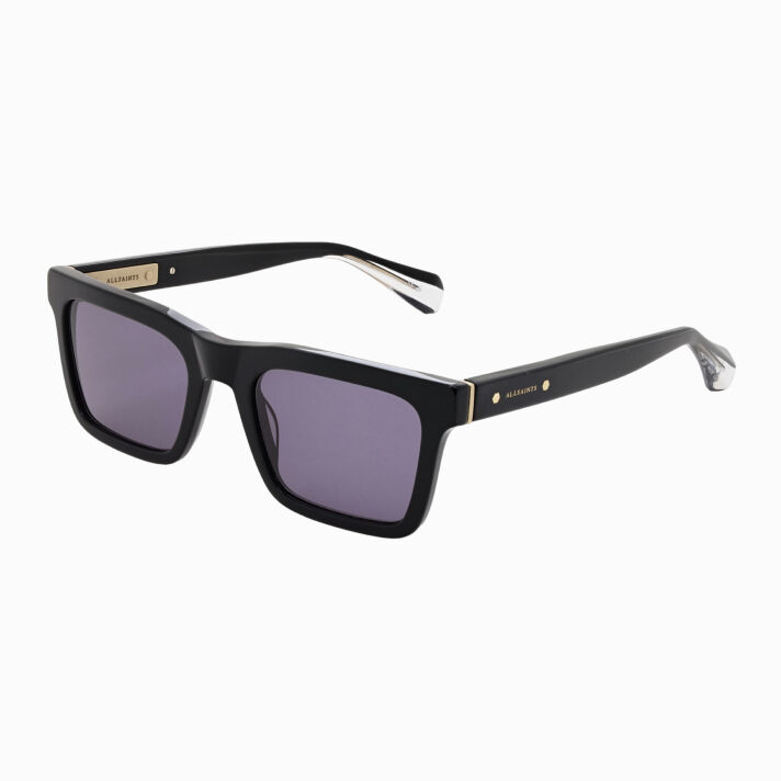 AllSaints Jett Black rectangular sunglasses with gold accents on the arms, sleek and modern on white background.
