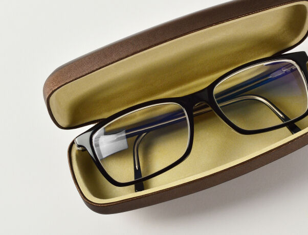 Eyeglasses stored in a protective case to prevent damage.