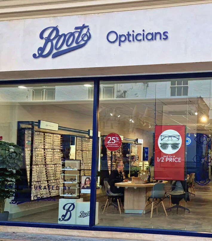 Boots Opticians store exterior with eyewear displays, inviting customers to find a local store.