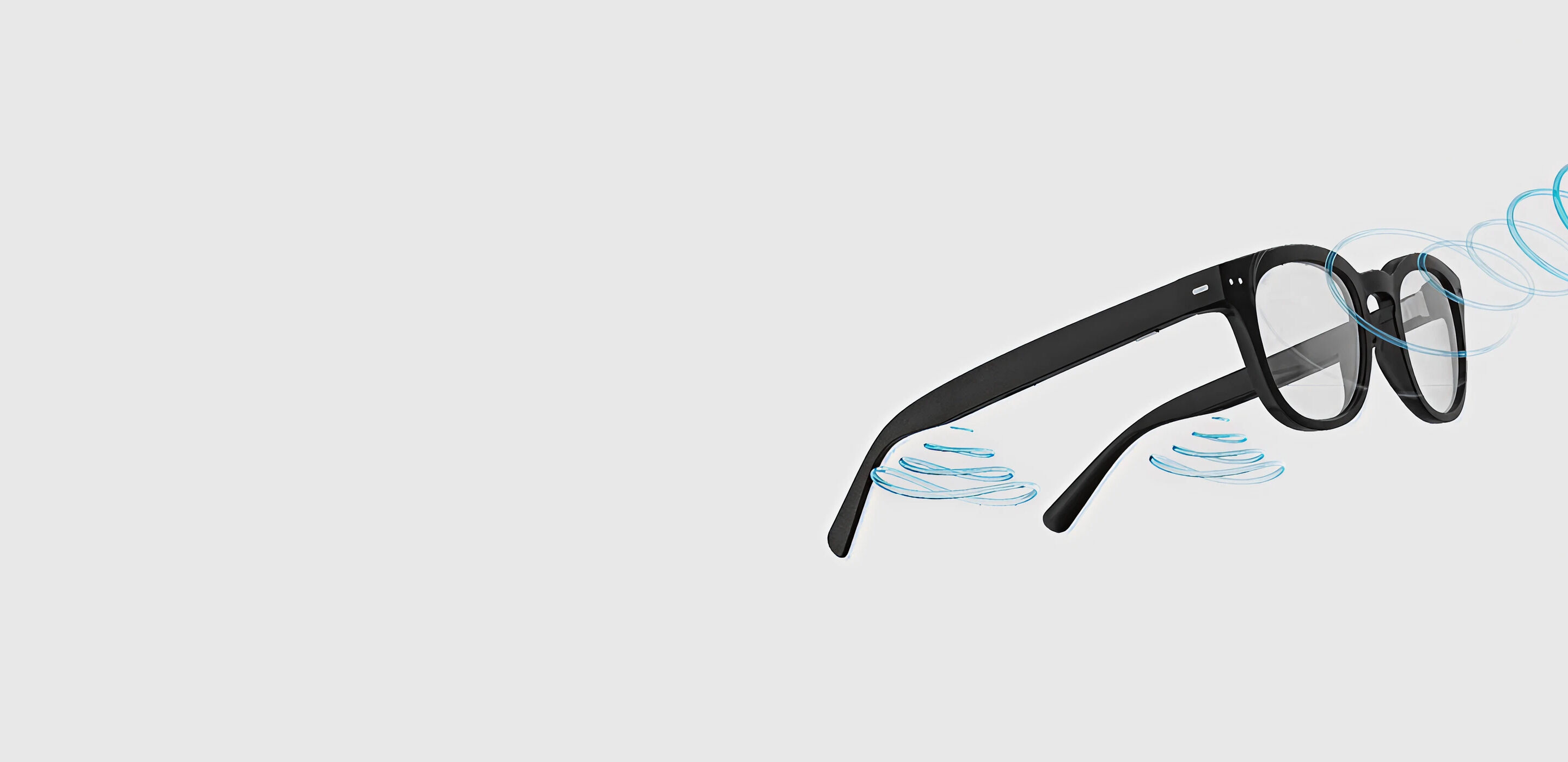 Nuance audio glasses floating with sound waves, highlighting built-in hearing technology.