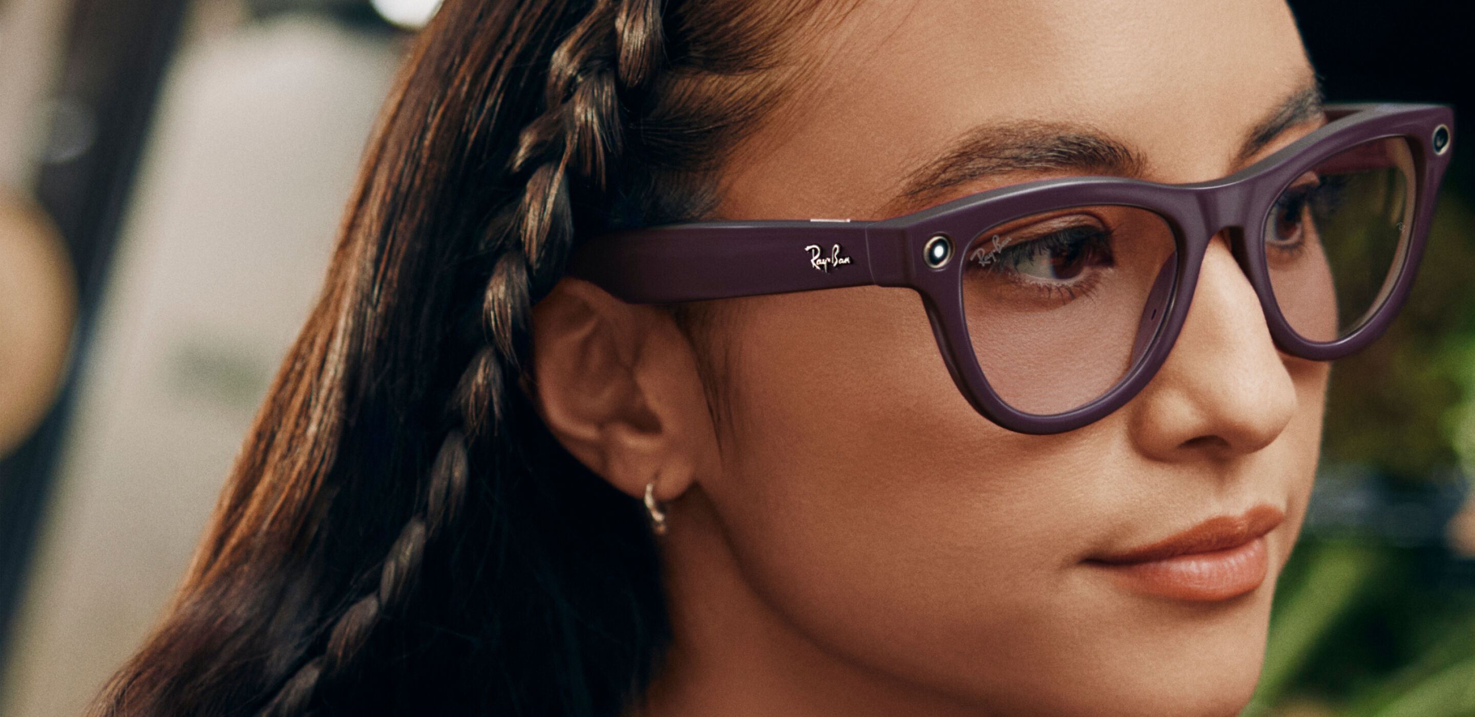 Woman wearing purple smart glasses, styled confidently in soft lighting for smart eyewear